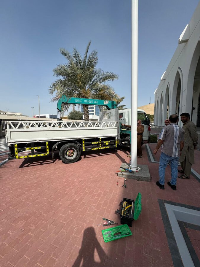 Flagpole installation at building entrance
